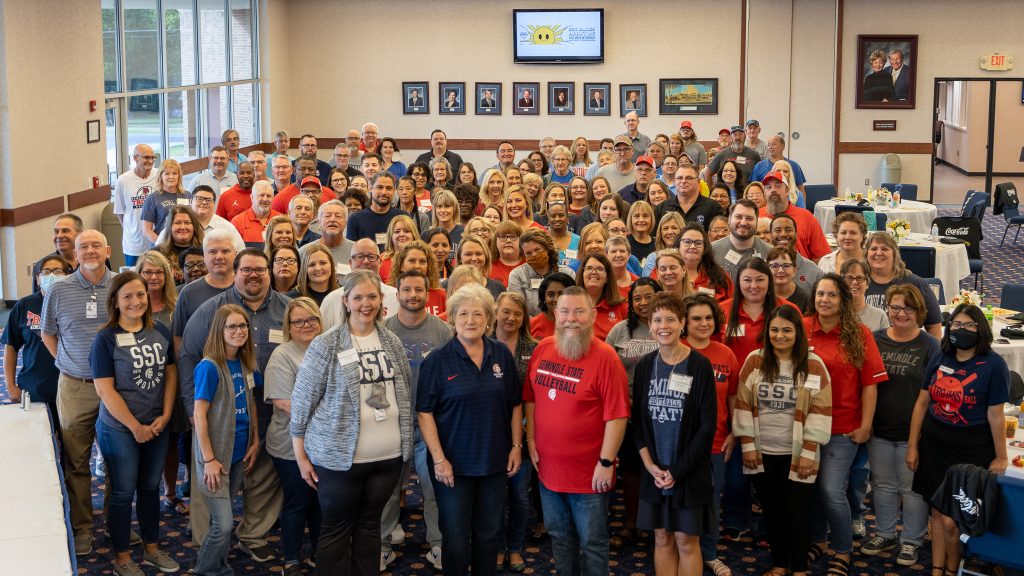 SSC Administration, Faculty, and Staff gather for a photo at In-Service meetings August 2022 in the Haney Center Ballroom, aerial photo of group in SSC spirit wear