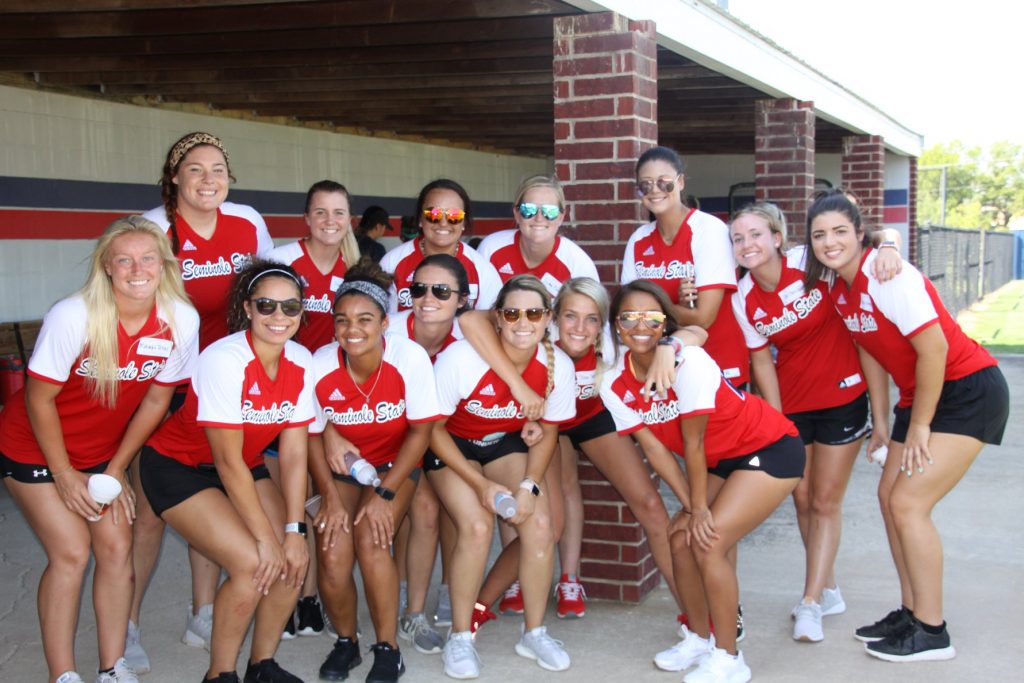 The current 2018-19 Trojan softball players pose for a photo during the program’s 20th anniversary celebration. Pictured (l-r) on the back row are: Ally Lewis of Enid; Shianne Eddings of Cleveland; Kassidy Randall of Wynewood; Sydney Martin of Davis; Taiah Harris of Antlers; Jaci Oakley of Shattuck; and Haley Womack of Bixby. Pictured (l-r) on the front row are: Makayla Jones of Perkins; Shayla Harper of Durant; Kiya Monawhee of Morris; Charlie Barnhardt of Wewoka; Jolie Romine of Davis; Jocee Sparks of Maud and Suni Meely of Tecumseh.