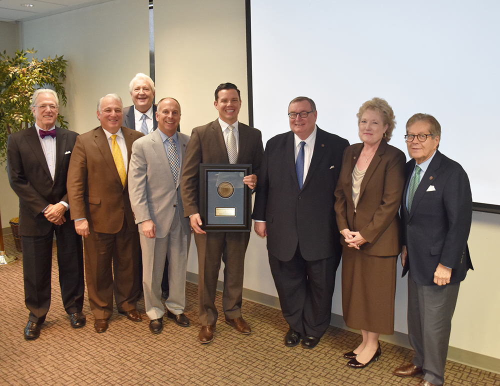 Pictured, left to right, are Regent Joseph L. Parker Jr., Regent Andy Lester, Regent Michael C. Turpen, Regent Jeffrey W. Hickman, Sen. Smalley, Chancellor Glen D. Johnson, Seminole State College President Lana Reynolds and Regent Ronald H. White