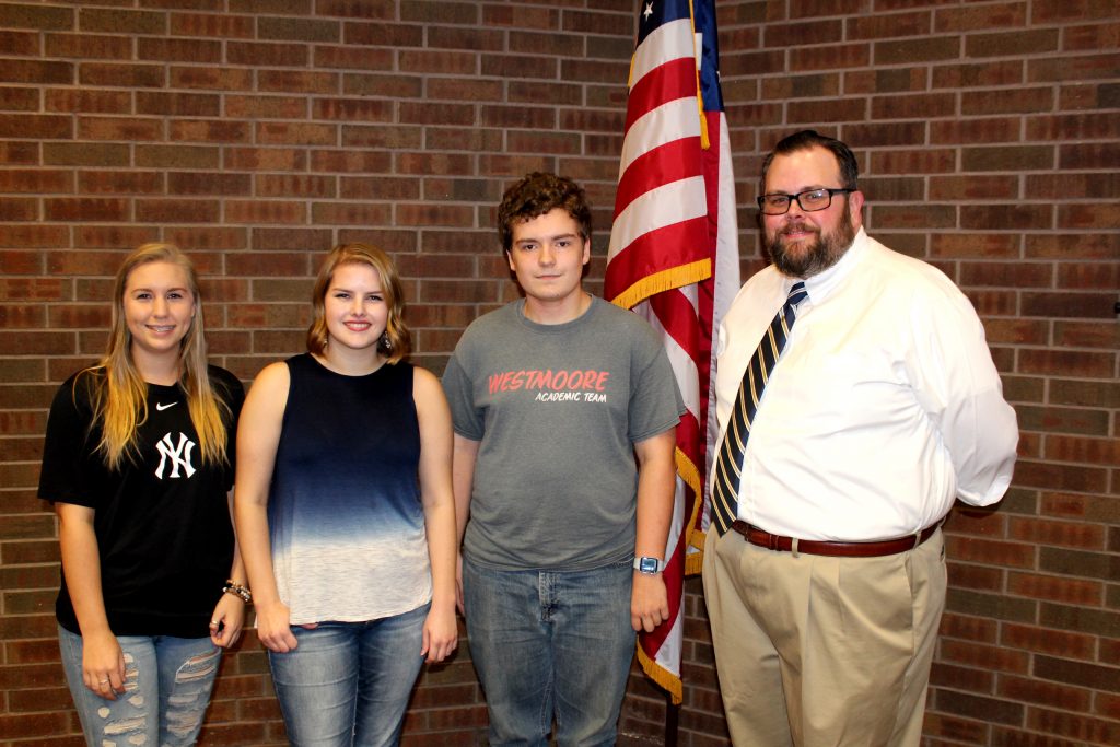 Pictured (left to right), SSC students Jordyn Moore of Shawnee, Taryn Washburn of Shawnee and Eric Hutchison of Moore stand by Constitution Day organizer and SSC Associate Professor of Government Jeffrey Christiansen following “Constitution Jeopardy!”