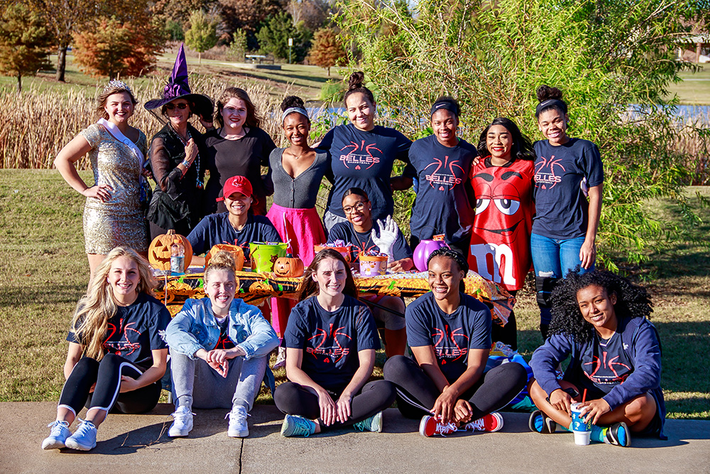 Members of the SSC women’s basketball team prepare to hand out candy to area trick-or-treaters.