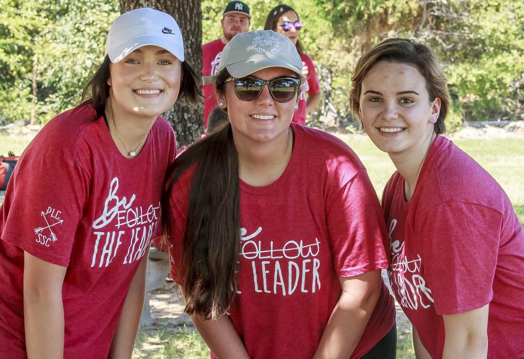 PLC students (l-r) Adrienne Foster of Seminole, Kenzie Sheldon of Prague and Cattie Lesley of Okemah stop to take a photo together before starting the team building games at St. Crispin’s Lodge