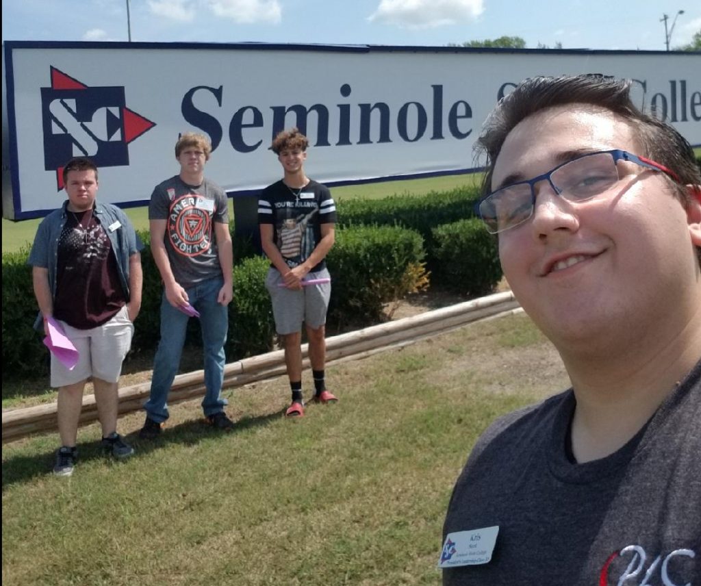 Pictured (L-R), Beau Johnston, Weleetka; Tie Ehler, Davenport; Jordan Rodriquez, Seminole; and Kris Scott, Seminole pose in front of the Seminole State College sign at the corner of campus.