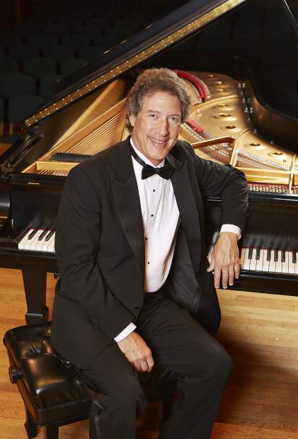 Peter Simon at a Piano.