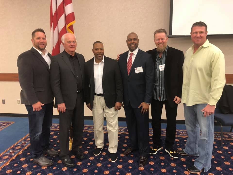 Members of the 1992 Trojan baseball team pose for a photo following the banquet, from left to right: Trojan alumni Jeff Stych, former Trojan Head Coach Lloyd Simmons, current Trojan Head Coach and alumni Mack Chambers, alumni and guest speaker Carlos James, SSC Regent and alumni Ryan Franklin and alumni Lance Calmus.