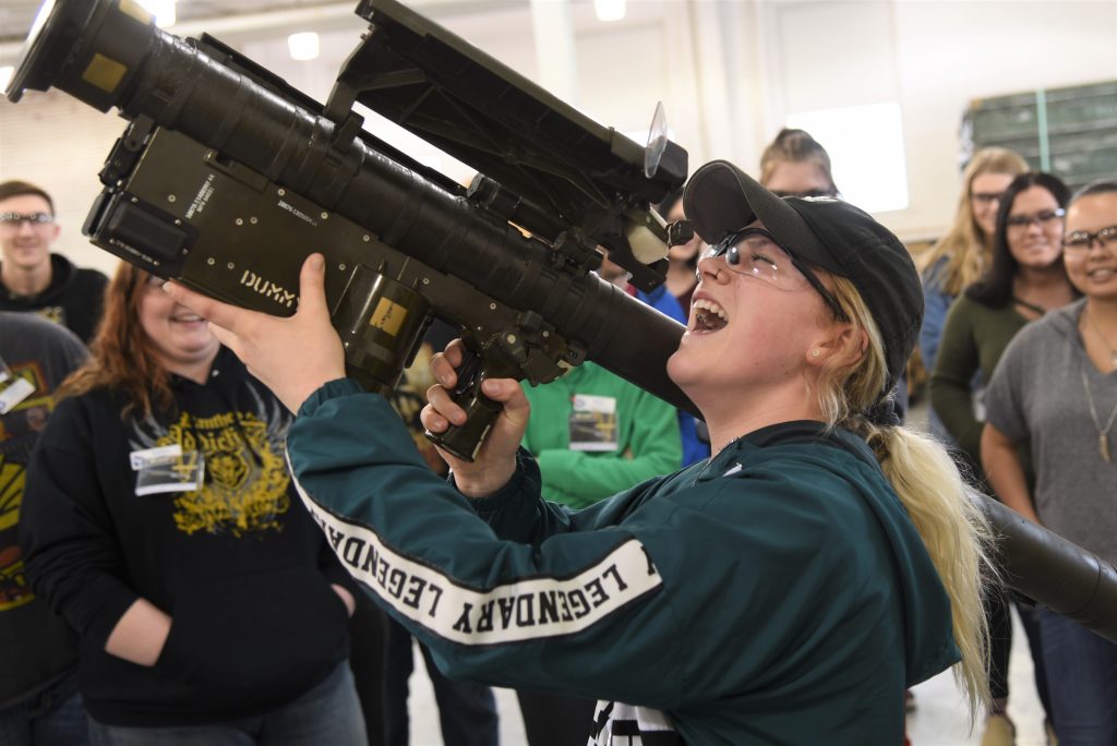 PLC sophomore student Triniti House  shoulders an inert Stinger surface-to-air missile (SAM) launcher