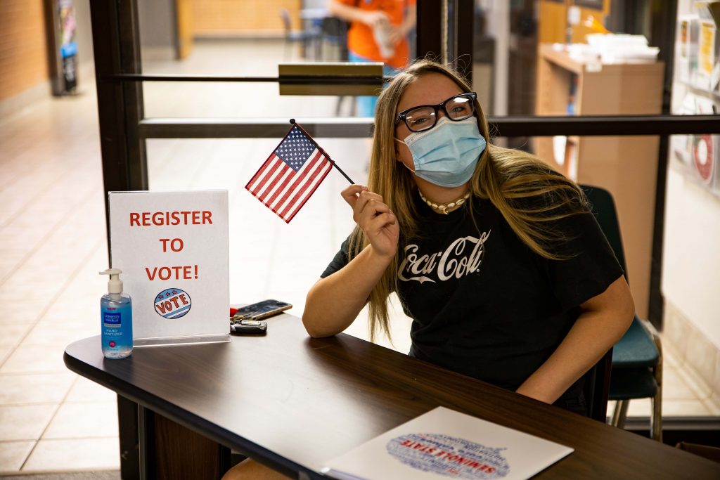 PLC student registers students to vote.