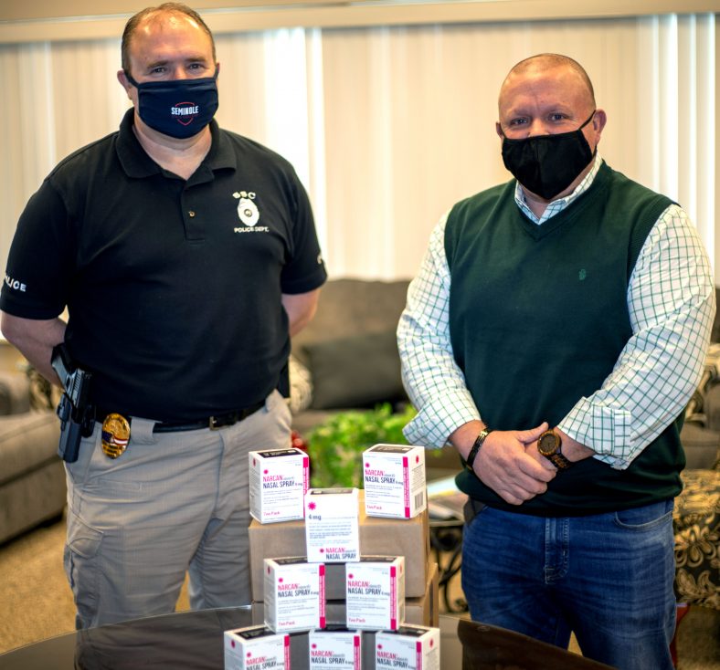 SSC Police Chief Shane Marshall (left) thanks Gateway to Prevention and Recovery Coordinator David Holland (right) for the donation of 10 NARCAN kits to Seminole State College on Feb. 2.