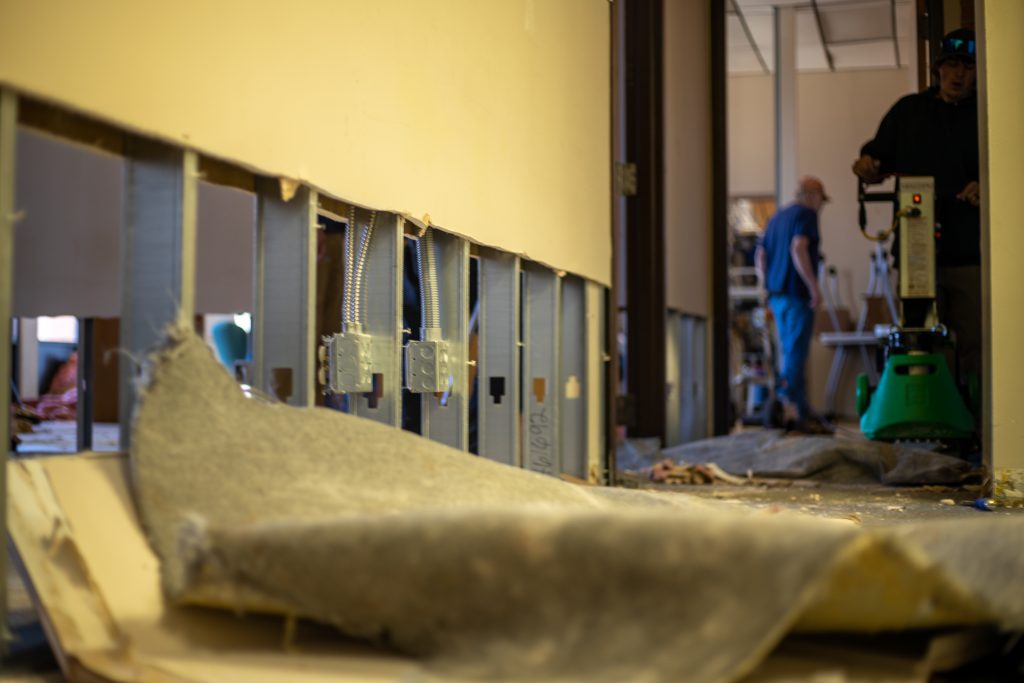 Cleanup under way to repair Damage from the winter storm in the north classrooms of the David L. Boren Library.