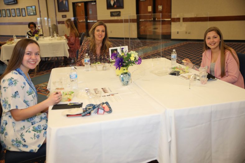 Co-Owner of the Kinslow Group Brooke Case (center) speaks with PLC students Tiffany Maxey of Catoosa (left) and Kandyce Davidson of Wewoka (right) during the Women’s Leadership Luncheon. In groups of two, students rotated from table to table to meet and discuss with the event’s speakers.