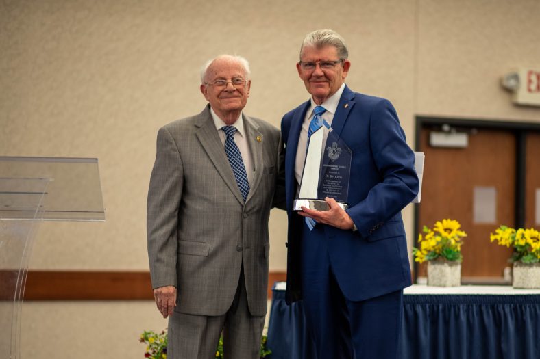 Former SSC Regent Melvin Moran (left) presented the Distinguished Service Award to former SSC President Dr. Jim Cook (right) at the banquet.