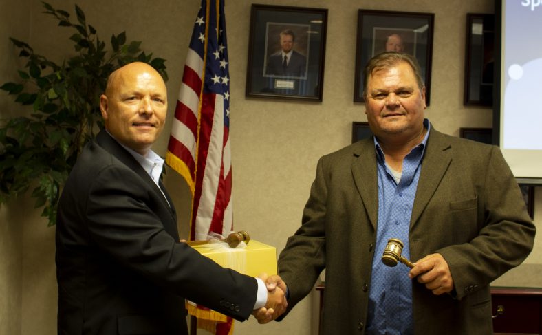 SSC Board of Regents 2020-2021 Chair Curtis Morgan (right) passes the gavel to incoming Chair Ray McQuiston (left).