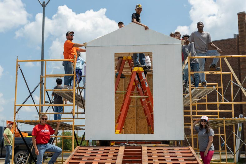 Students participating in the Engineering and Construction Management camp at SSC are shown during construction of a tiny house on July 23.