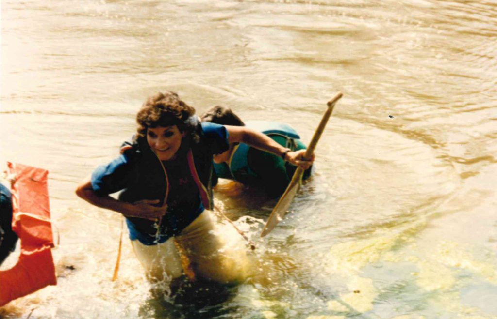 After an unsuccessful canoe race, former business office cashier Carolyn Simmons surfaces from the campus pond.