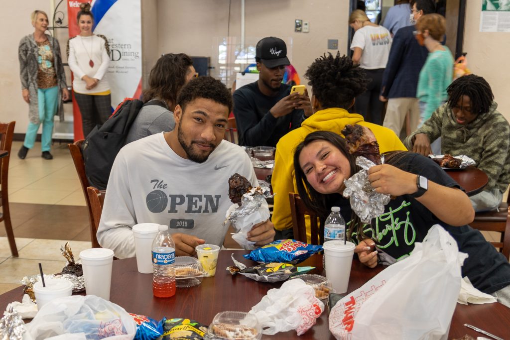 SSC students Elijah Durham, of El Reno, and Uriah McPerryman, of Wetumka, enjoy an assortment of fair food during the event.