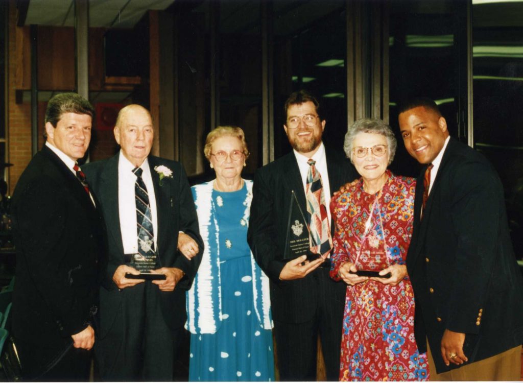 Pictured left to right with Dr. Cook, are: long-time Varnum School Superintendent Eugene Warrenburg; retired SJC Reading Instructor Frances Warrenburg; former Wilson Elementary School Principal Bonnie Lee Grisso; former Seminole civic leader and business owner Neil Molleur; and former Trojan basketball player and NAIA National Championship Coach at Oklahoma City University Win Case.