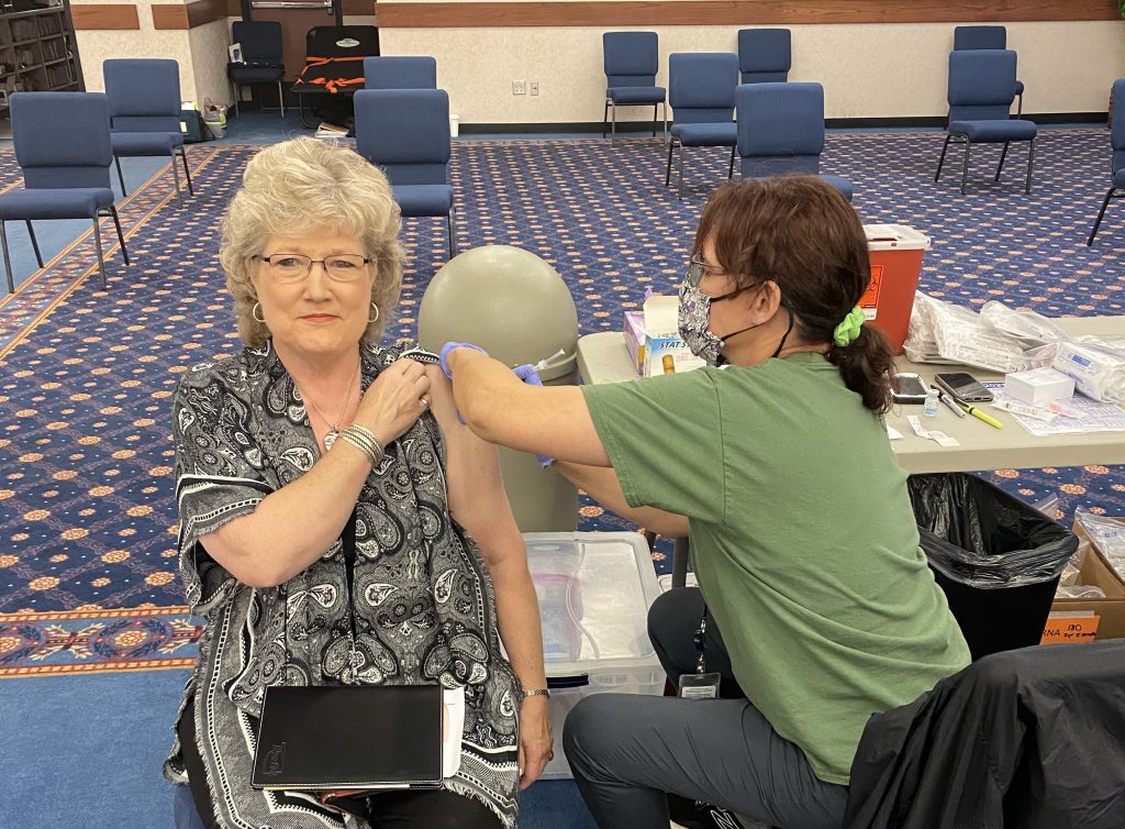 SSC President Lana Reynolds receives a COVID-19 booster shot during the health clinic on campus Oct. 27.