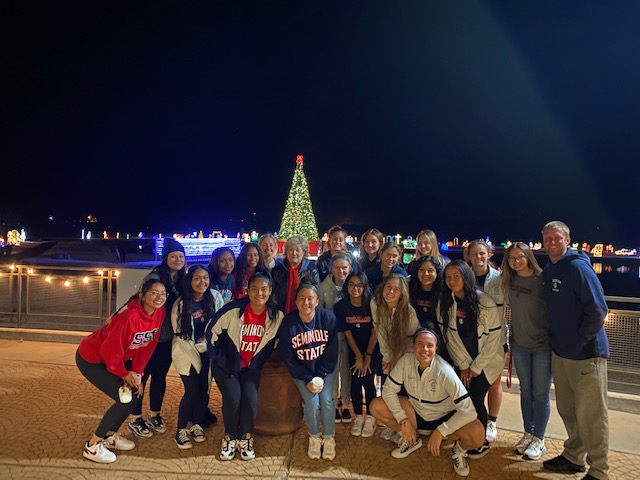 SSC President Lana Reynolds (center) and Coach Dan Hill (far right) enjoy the Snowman Wonderland light display with members of the women’s soccer team.