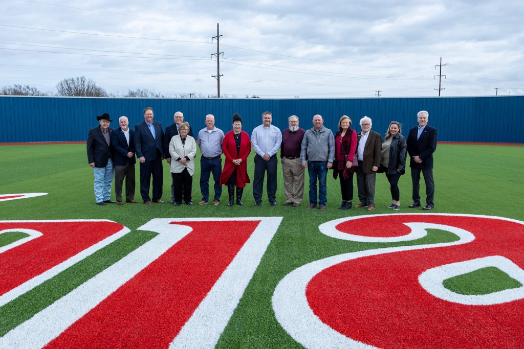 Several Trustees of the Seminole State College Educational Foundation toured the Brian Crawford Memorial Sports Complex following their quarterly Board meeting on Feb. 16. The Trustees toured indoor facilities and the Trojan baseball field. Pictured in Center Field (left to right) are: Jim Hardin, Lance Wortham, Jeramy Rich, Doug Humphreys, Sue Snodgrass, Steve Degraffenreid, Suzanne Gilbert, Darren Frederick, David Wilson, Billy Norton, Rhonda McKee, John Hargrave, Haley Coates and Mark Schell.