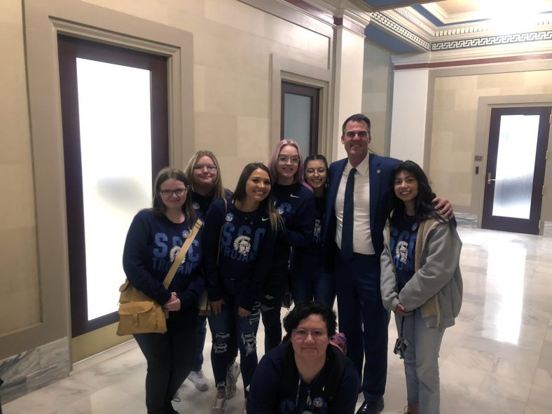 Seven SSC students pose with Gov. Kevin Stitt for a photo during the Oklahoma Promise Day event at the capitol on April 20. Pictured (left to right): Heather Cauley of Wewoka, Ava Adams of Seminole, Chole James of Broken Bow, Jenna Harrison of Tecumseh, Gracie Miller of Wewoka, Gov. Stitt, Rebekah Choate of Seminole and Katelyn Nguyen of Weleetka.