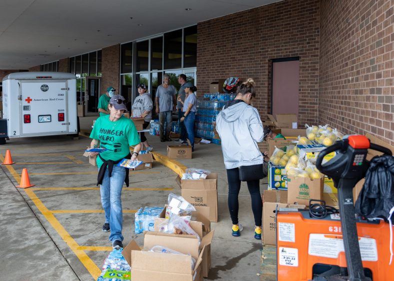 American Red Cross volunteers unload supplies for the relief effort outside the Enoch Kelly Haney Center on the SSC campus on May 5.