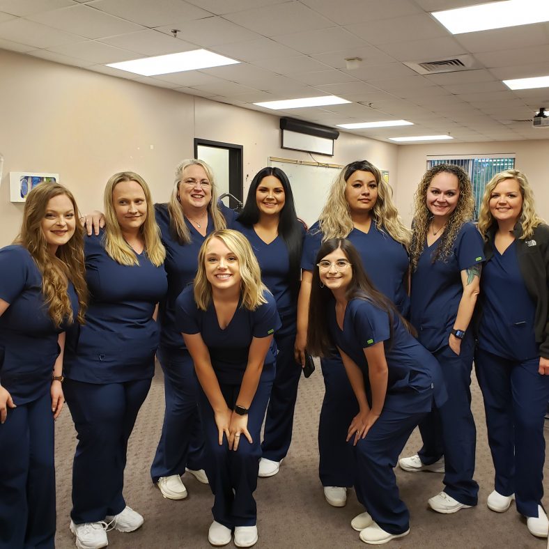Nursing students pose for a photo before their pinning ceremony at the Enoch Kelly Haney Center on May 23.