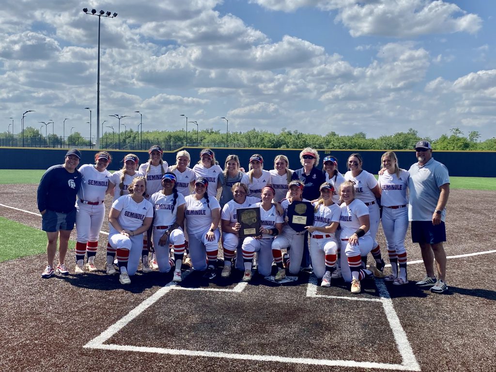 Posing for a photo with their NJCAA Region II Championship trophy is the Seminole State College Softball team and SSC President Lana Reynolds.