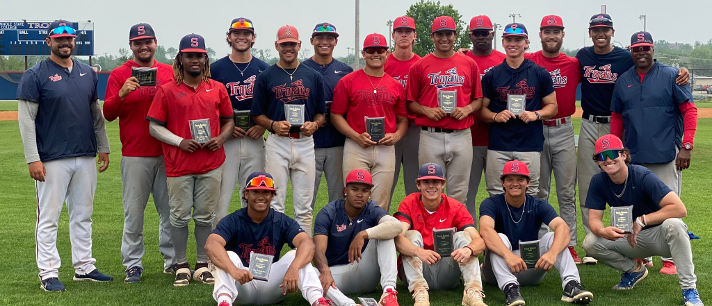 Baseball team poses following game