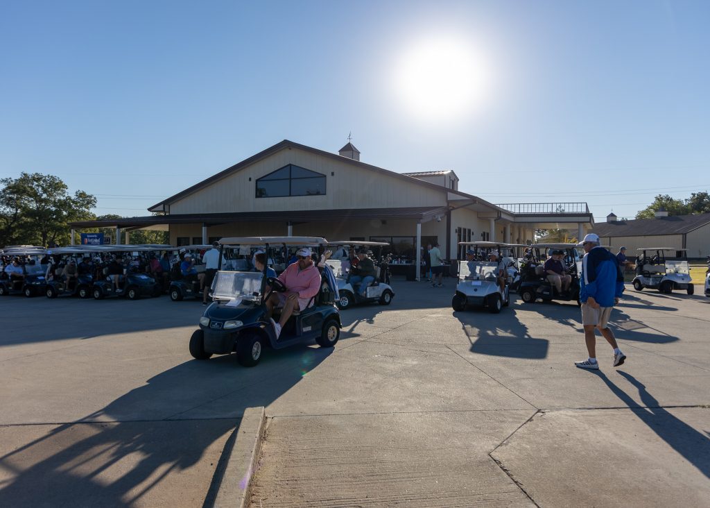 A large group of golfers take off in their carts to start the Seminole State College Educational Foundation 26th Annual Golf Tournament.