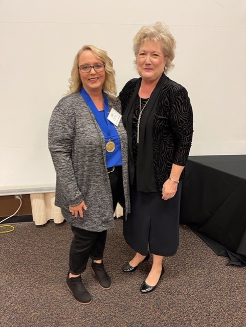 SSC President Lana Reynolds (right) congratulations Admissions Clerk and VA School Certification Officer Stacey Foster (left) for being named the College’s “Staff Member of the Year.”