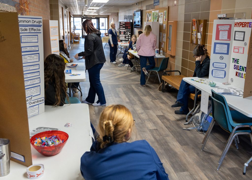 Leadership in Nursing students are shown tending their booths during the Seminole State College Nursing Division health fair on Nov. 30