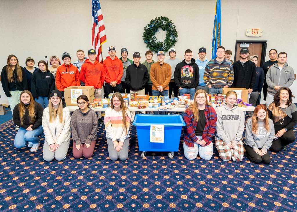The Seminole State College Leadership Development Class poses with recent donations of dozens of canned and packaged food goods.