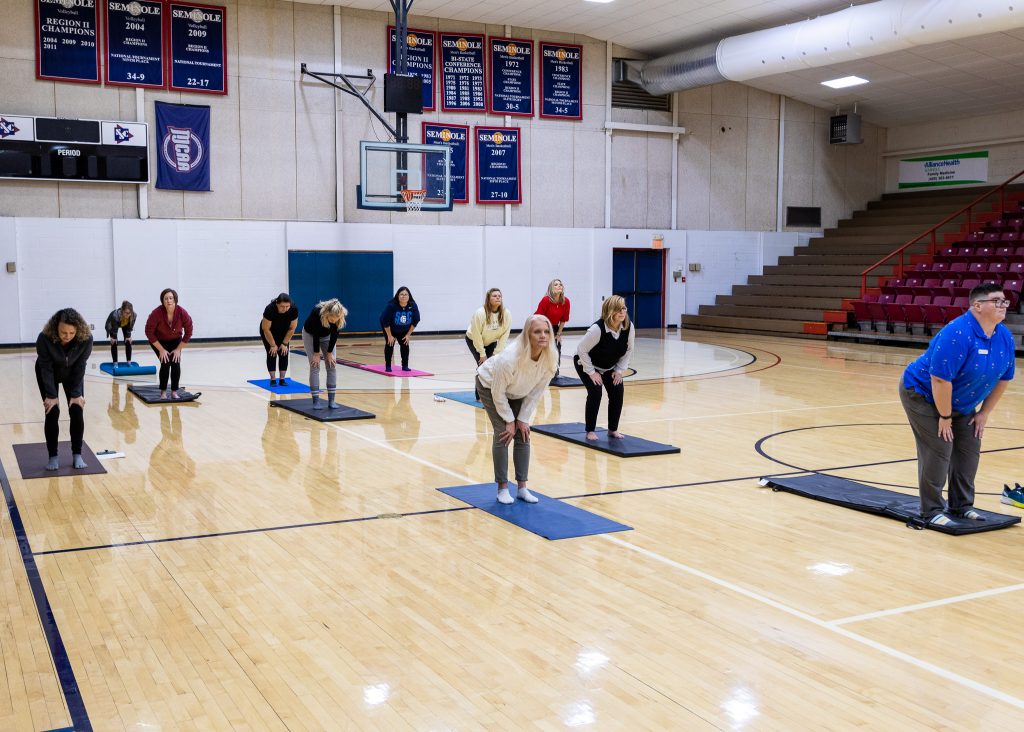 The Seminole State College Wellness Committee participate in a Yoga session led by Main Street Yoga owner Lauren Schatzel.