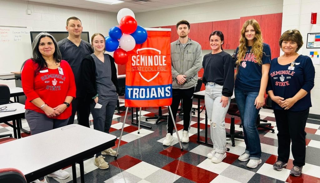 (Pictured left to right): PTA Program Director Shakira Stafford, PTA students Christopher Howell, Megan Whited, Matt Ramirez, Paige Risenhoover, Summer Ralson and Academic Coordinator of Clinical Education Peggy Newman greeted attendees at the meet and greet on Jan. 19 at Gordon Cooper Technology Center in Shawnee.