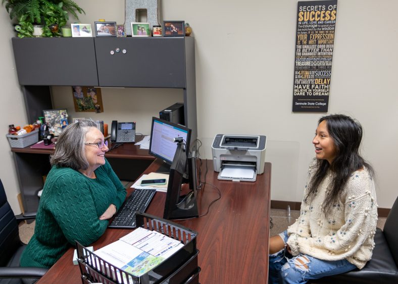 SSC Advisor Carmen Hutchins (left) helps Tianah Tucker, of Shawnee, enroll for the Spring Semester.