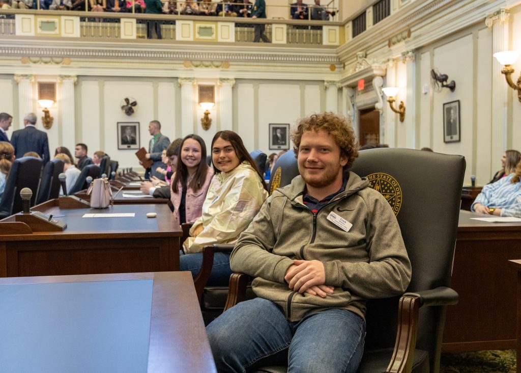 President’s Leadership Class sophomores (left to right) Allyson Randall, Okemah; Kaden Morris, Holdenville; and Frank Bourlon, Bethel take seats in the chambers of the House of Representatives to hear speakers during a Higher Education Day program.