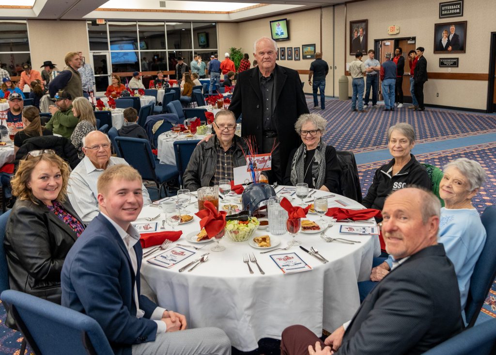 Longtime fans and supporters were among the guests at the Trojan Baseball Season Kick-off Banquet Saturday evening. Pictured (left to right) are: Daylan Saxon, Lisa Saxon, Les Walker, Jim Hardin, Former Trojan Coach Lloyd Simmons, Dr. Donna Hardin, Jill Reynolds, Bettie Conn and City Manager Steve Saxon.