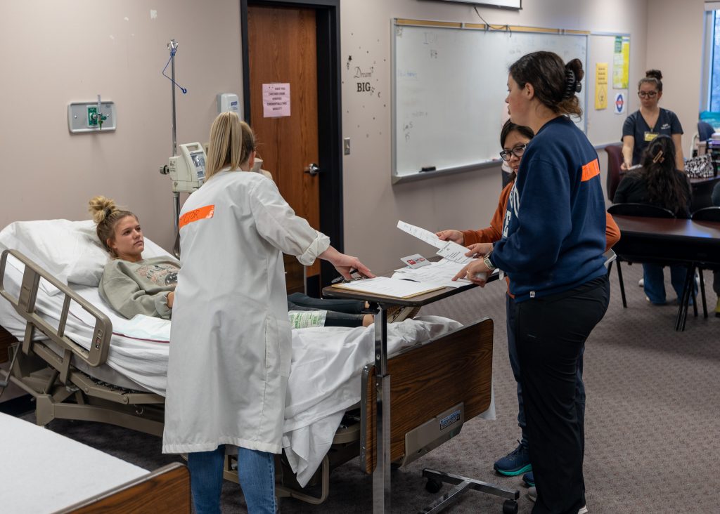 Pictured are SSC Nursing Students, as they take on various roles during the simulation. Victims were transported from the site of the incident to a makeshift treatment center set up in a nursing classroom, where they were treated by their classmates.