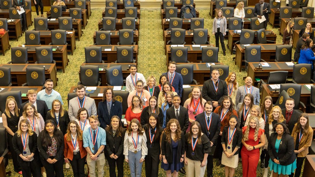 All-Oklahoma Academic Team honorees and Tuition Waiver recipients pose for a photo following the awards assembly on the chamber floor of the Oklahoma House of Representatives.