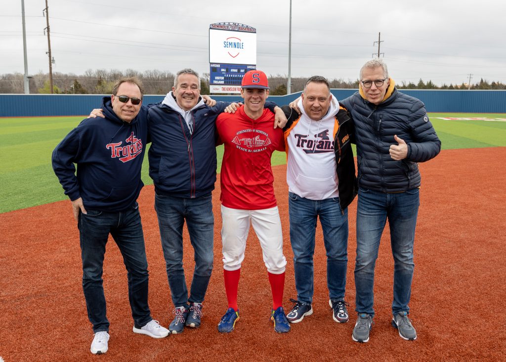 Seminole State College freshman pitcher Gio DeGraauw, of Hilversum, Netherlands, was reunited with his father, uncle and two family friends this week. His biggest fans made the long trip to watch a few games in person and experience the sights and sounds of Oklahoma. The group posed for a photo following the Trojan baseball team’s 14-4 victory over Cowley County Community College of Arkansas City, Kansas on March 21. Pictured (left to right): Wynand DeGraauw, Gio’s uncle; Henk Rosendal, family friend; Gio DeGraauw; Edwin DeGraauw, Gio’s father; and Harald Bartleds, family friend.