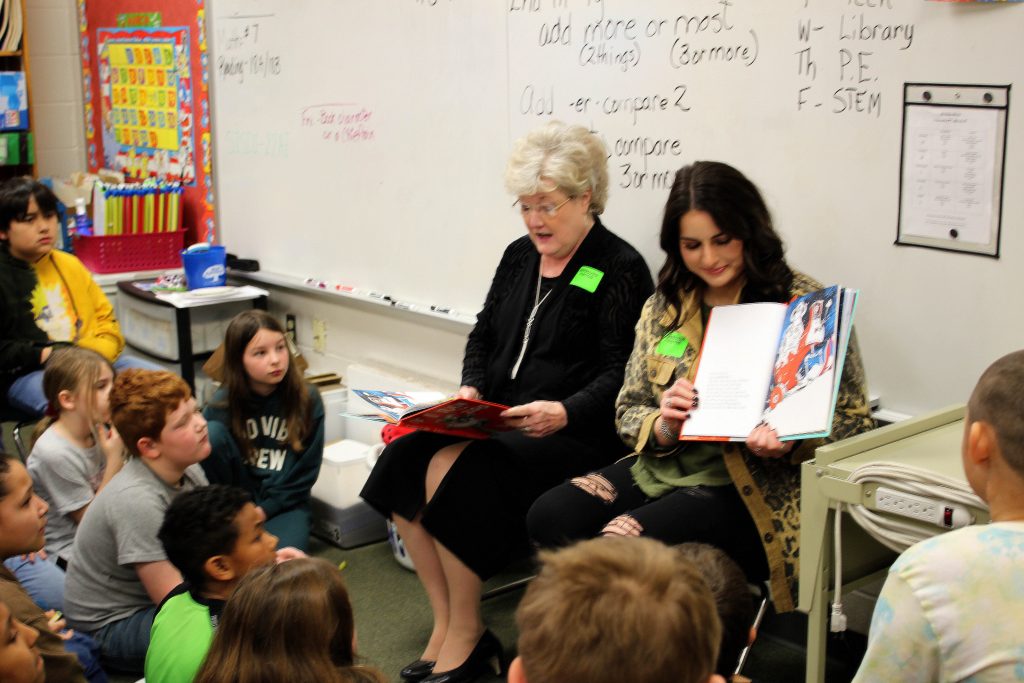 Seminole State College President Lana Reynolds and SSC President’s Leadership Class student Hailey Wallace, a sophomore from Wellston, read to Wilson Elementary School students.