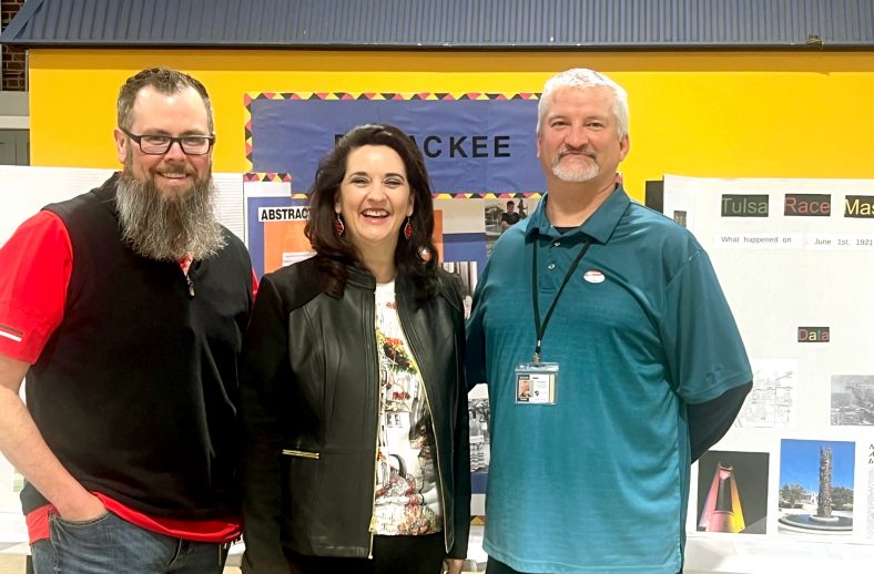 Seminole State College Professors of History Jeffrey Christiansen (left) and Marta Osby (centered) volunteered at The Academy of Seminole’s first History Fair, organized by TAOS History Instructor Kyle Moore (right), on March 7.