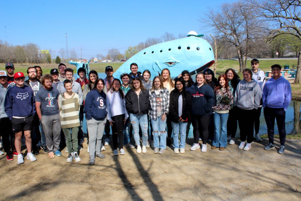 Members of the Seminole State College President's Leadership Class pose for a group photo in front of the Blue Whale of Catoosa, a waterfront attraction along Route 66, just east of the town of Catoosa.
