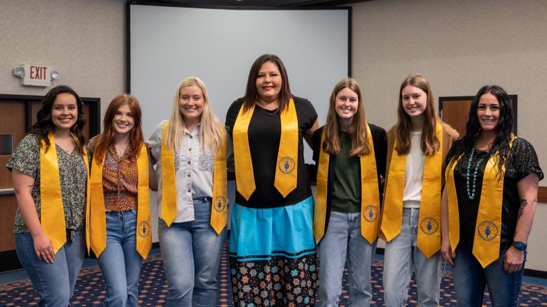 Pictured (left to right): Taleigh Estrada of Meeker, Emma Buchanan of Chandler, Emilia Gates of Seminole, Carrie Yerby of Maud, Hannah Ridley of Tecumseh, Abigail Ridley of Tecumseh and Tara Pool of Shawnee pose for a photo following the Psi Beta Induction.