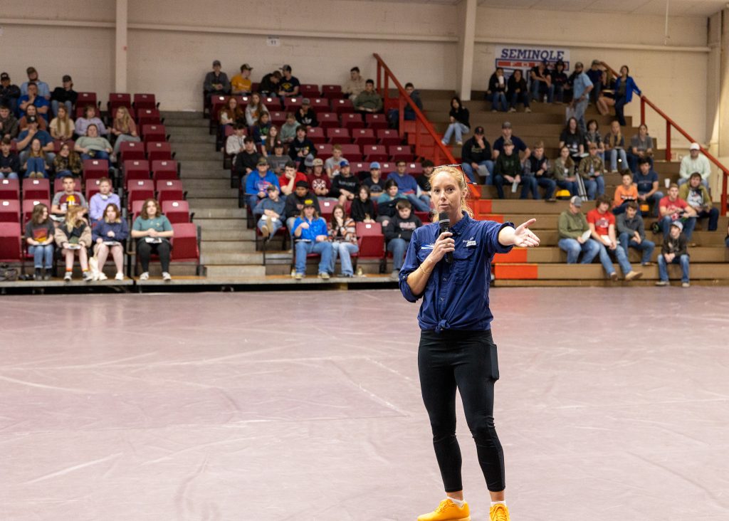 Pictured is Aggie Club sponsor and Assistant Professor of Agriculture Wendy Rich as she welcomes attendees before the contest began.