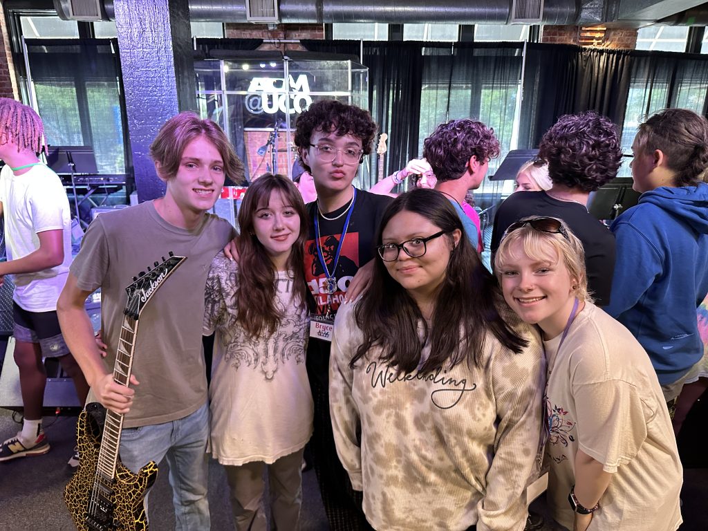 Talent Search/Focus students pose for a photo at Academy of Contemporary Music at the University of Central Oklahoma after watching a live performance.