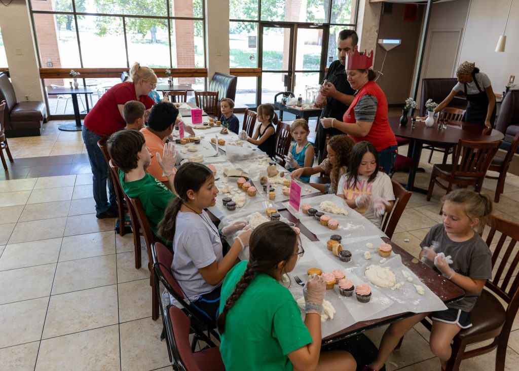 A new addition to this year’s Kids on Campus Summer Camp was culinary camp. Pictured, members of the Great Western Dining team taught attendees basic culinary skills and showed them how to make their own sweet treats.