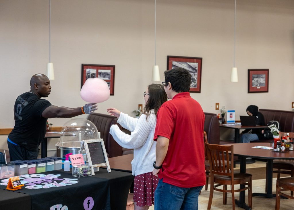Pictured: Students stand in line for free cotton candy during Welcome Week.