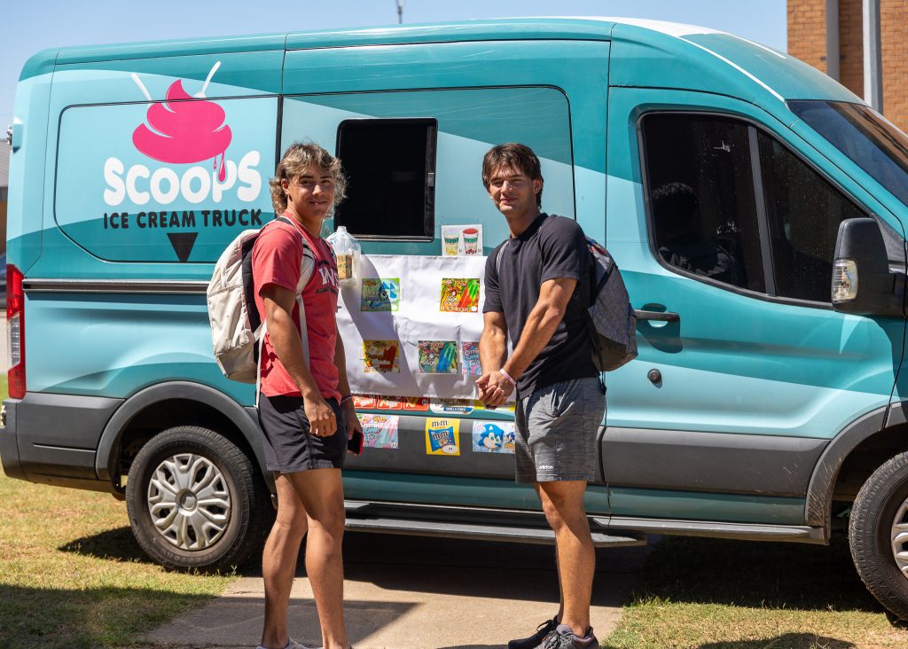 Pictured: SSC students pose in front of the Scoops ice cream truck during welcome week.