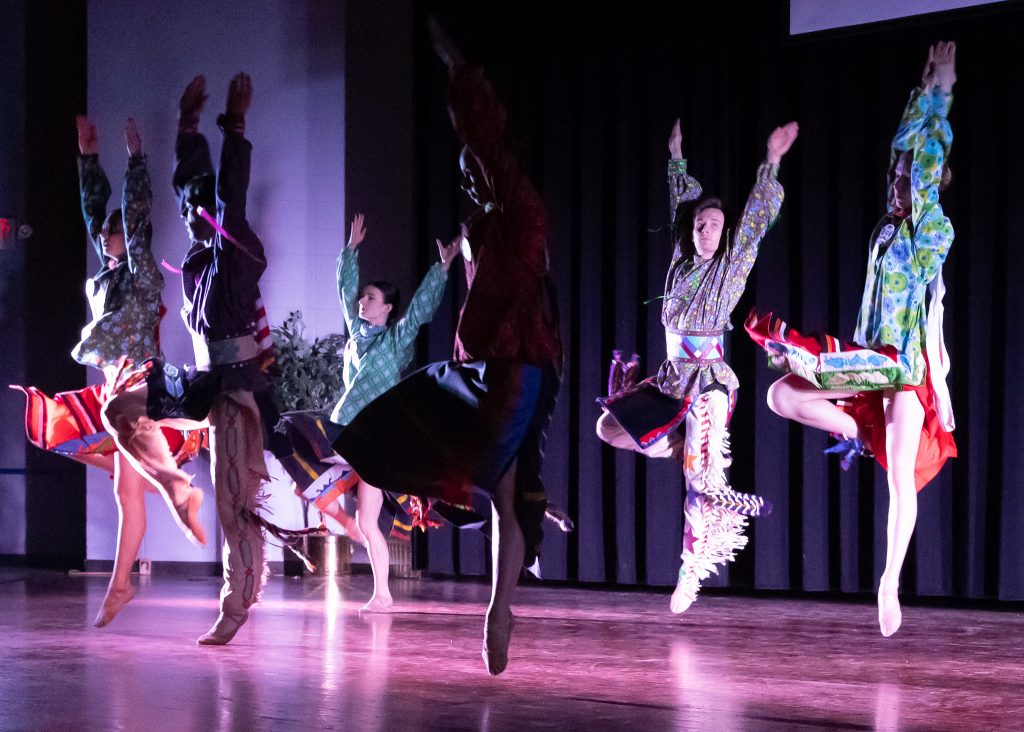 Pictured: Performers are shown on stage during the Osage ballet “Wahzhazhe” on Aug. 15 in the Jeff Johnston Fine Arts Auditorium.